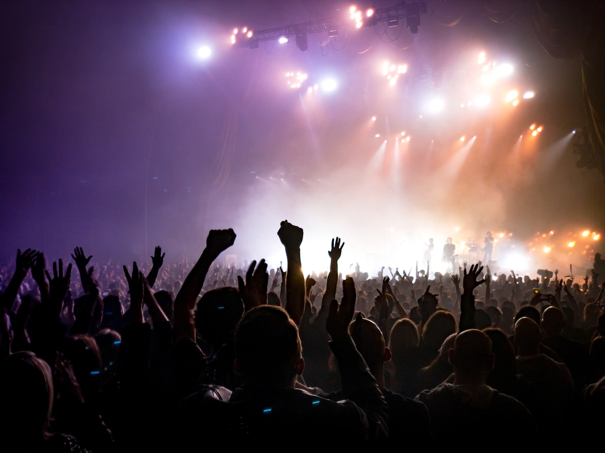 Concert crowd with stage lights - should you keep your earplugs in all night